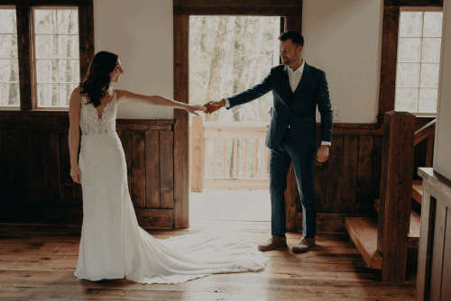 gif of bride and groom touching hands