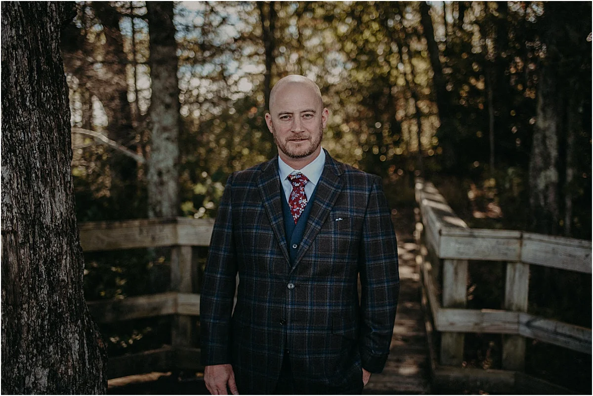 groom in wedding attire waiting for his bride