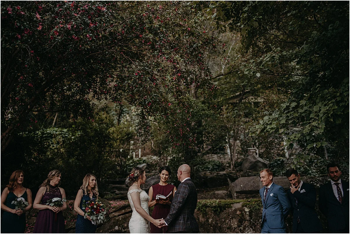 bride and groom standing at the altar