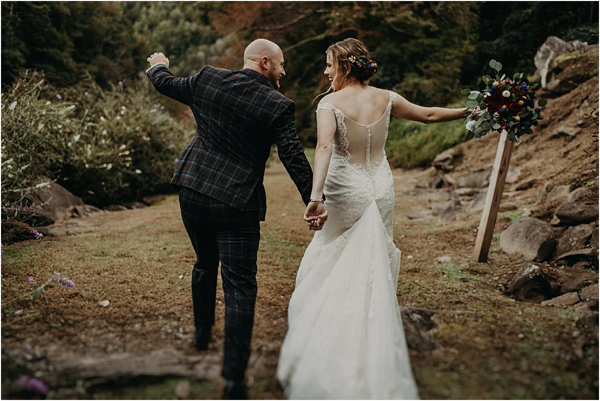 bride and groom celebrating marriage after ceremony