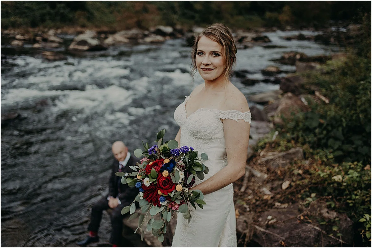 bride smiling and holding bouquet