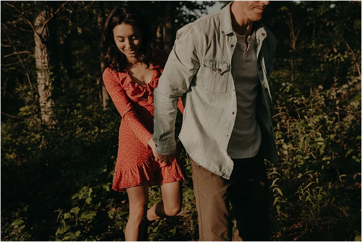 man leading his fiance through tennessee hills