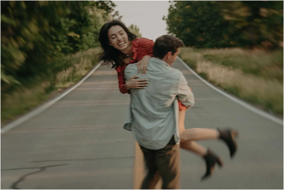 man picking up his fiance in middle of road