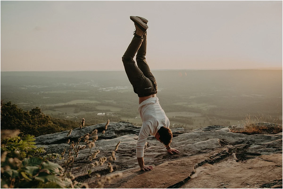 man doing handstand on rocks in tennessee hills
