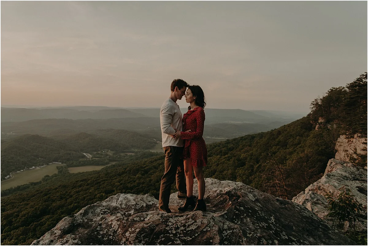 couple hugging on rocks overlooking tennessee