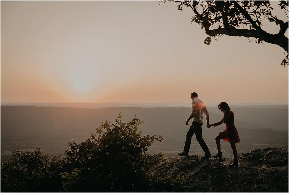 man leading his fiance over tennessee hills
