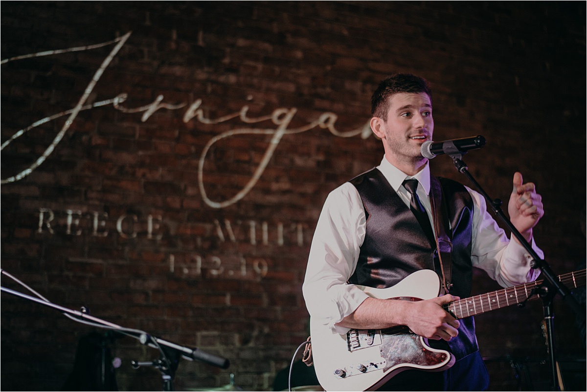The groom performed with the band during their wedding reception at Church on Main