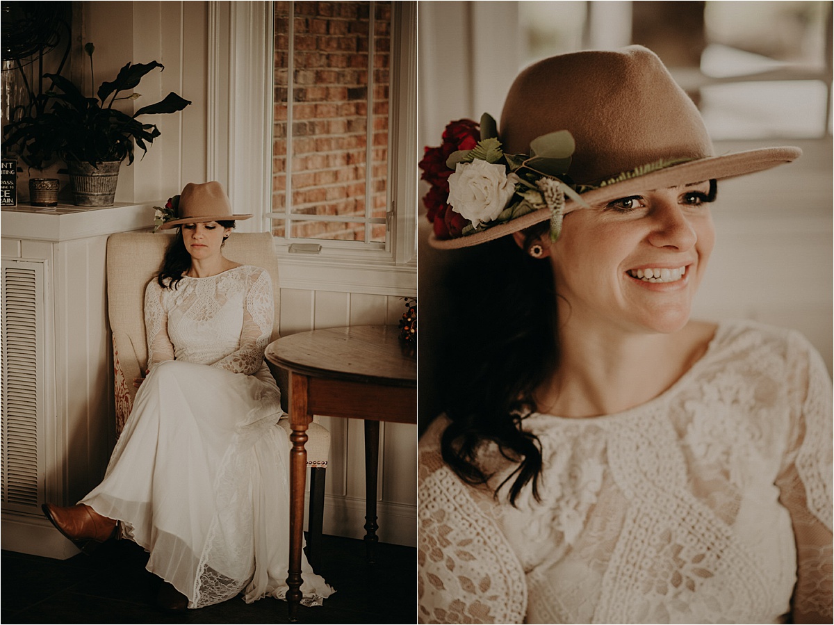 A boho bride in a Grace Loves Lace gown and camel hat with florals