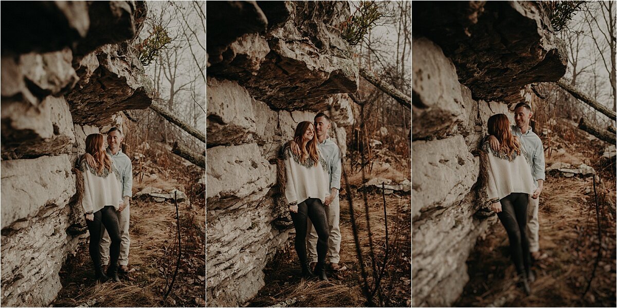 This couple is taking shelter beneath the rocks on this Tennessee mountain during their engagement session