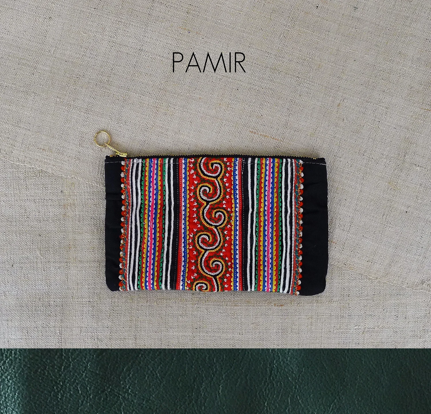 tribal textile + leather / zip fastening / inside pocket / name inspired by / The Pamir mountain range based in Central Asia, also known as the "Roof of the World" / approx size / 12cm x 18.5cm (4.5" x 7.5") / suitable for / make up bag / stationery case / wallet / toiletries bag / general storage
