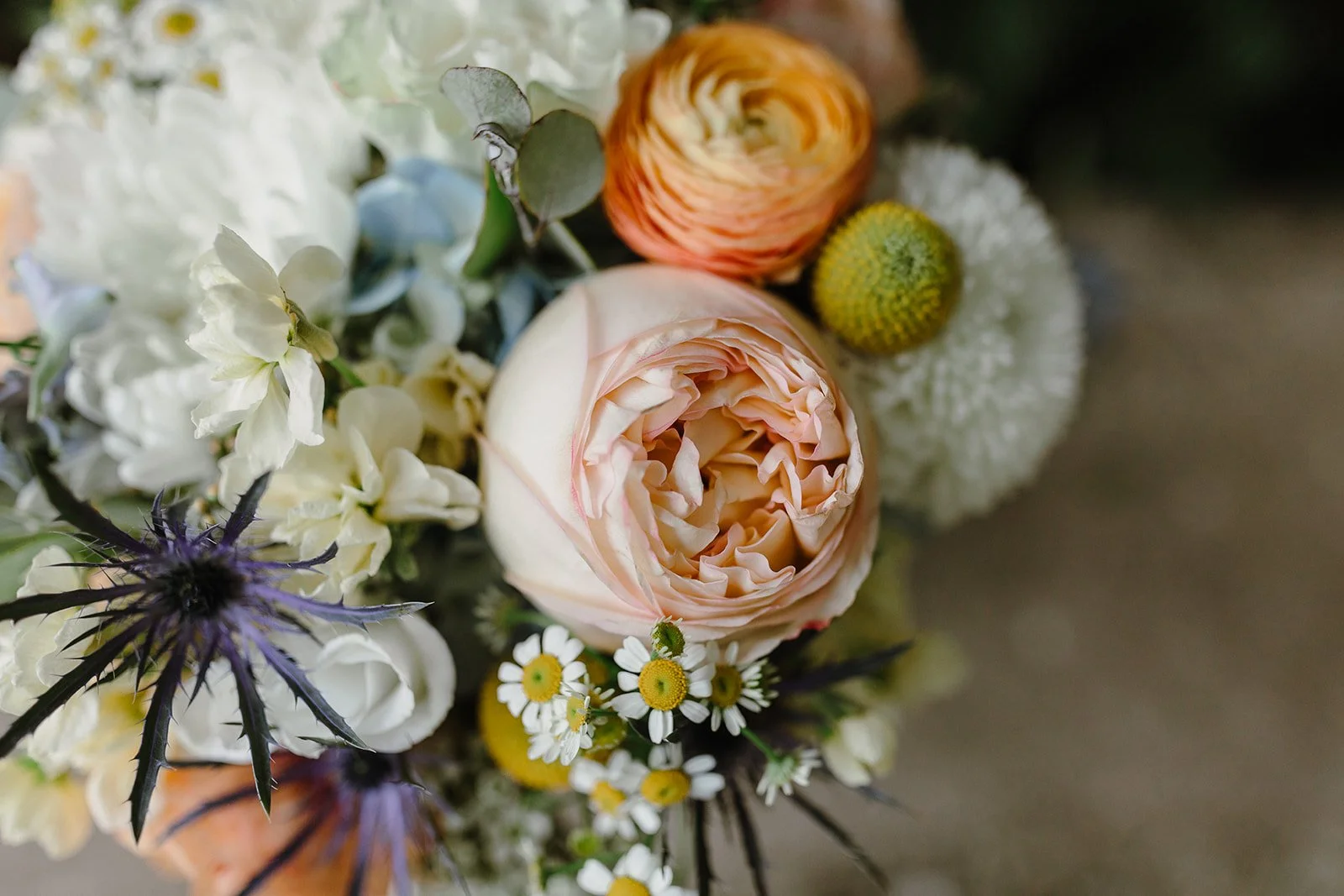 orange and pink ranunculus bridal bouquet