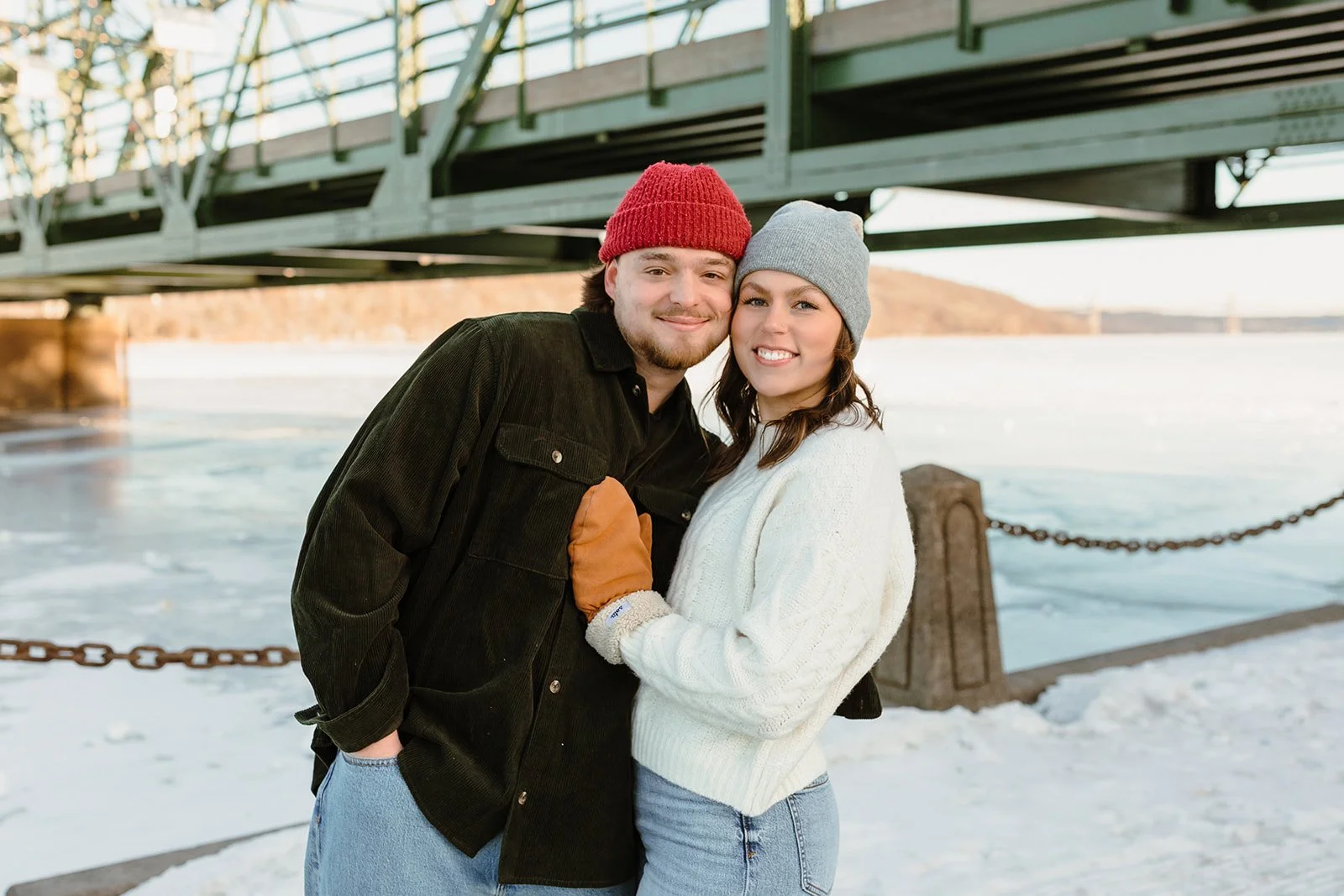 engaged couple along St. Croix River in stillwater in winter