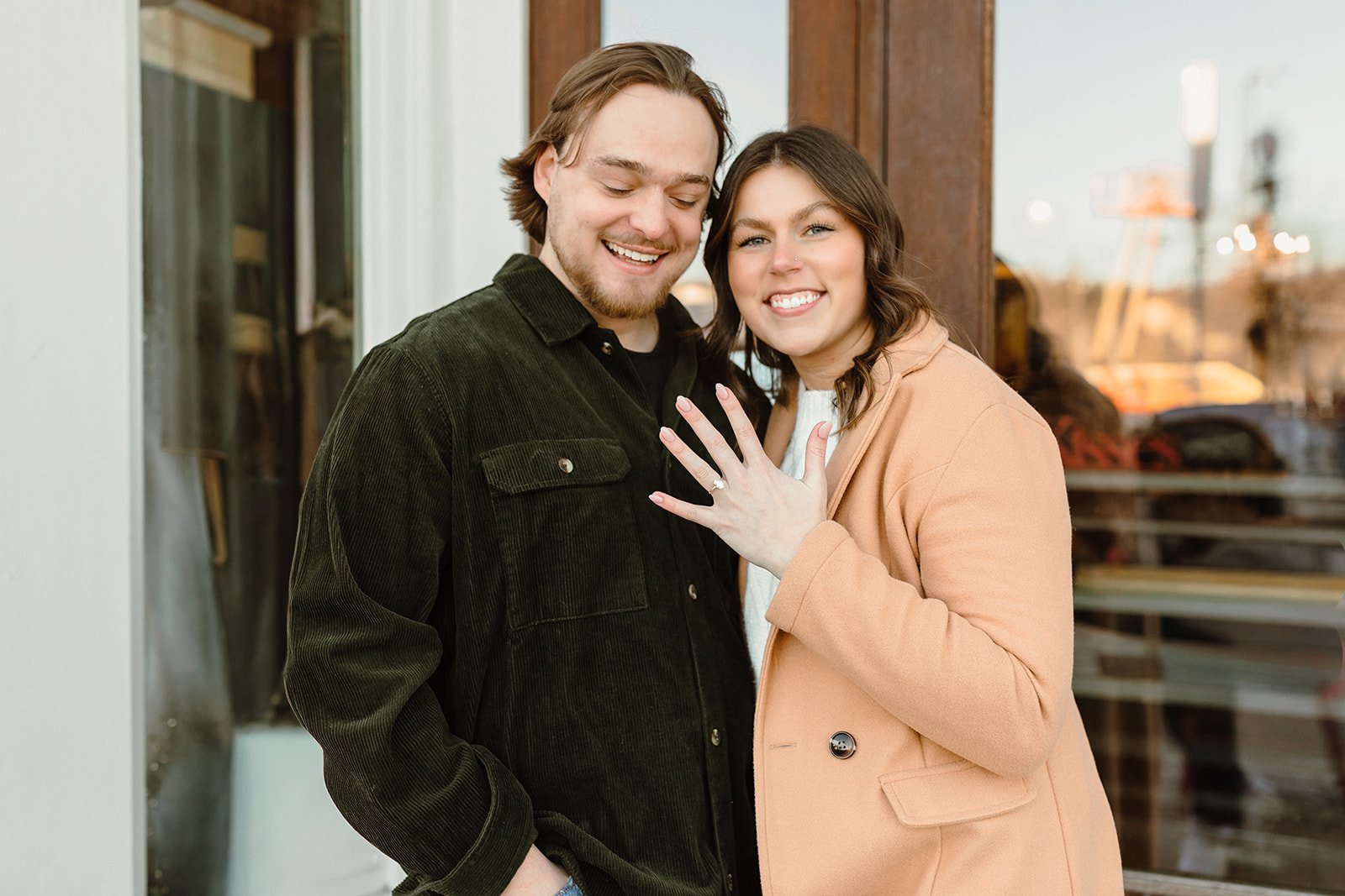engaged couple outside stillwater downtown