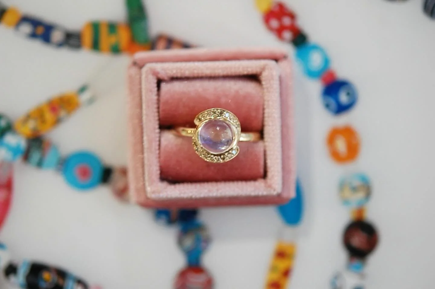 A halo of champagne diamonds cradles a luminous moonstone: glowing softly, like light captured in gold. The universe is yours baby. #charltonandlola #finejewelry