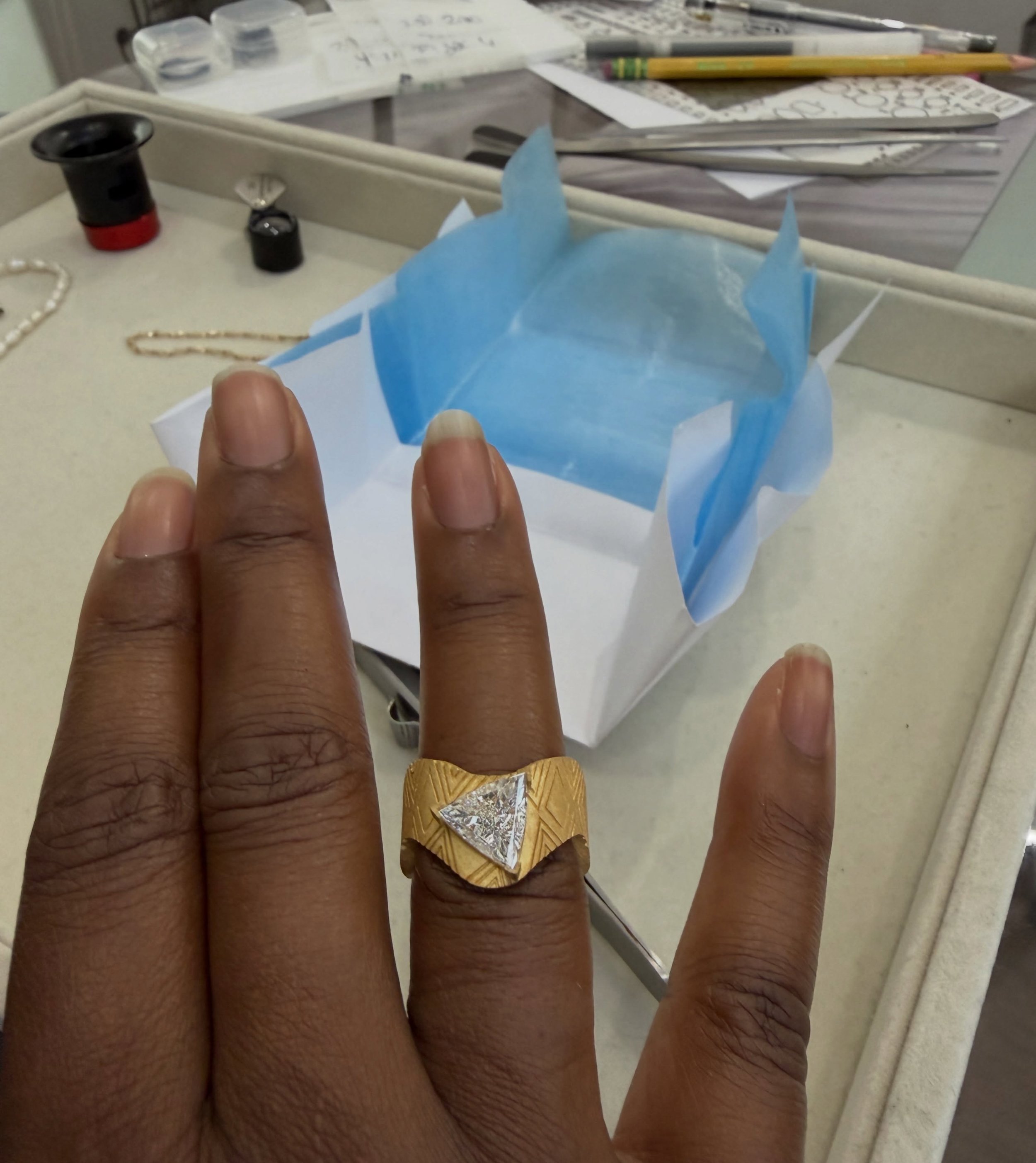 Before geometry became architecture, it was woven into cloth.

Before it was carved into gold, it carried stories.

Inspired by the rhythm and structure of traditional African textiles, this design pairs a modern trillion-cut diamond with patterns th