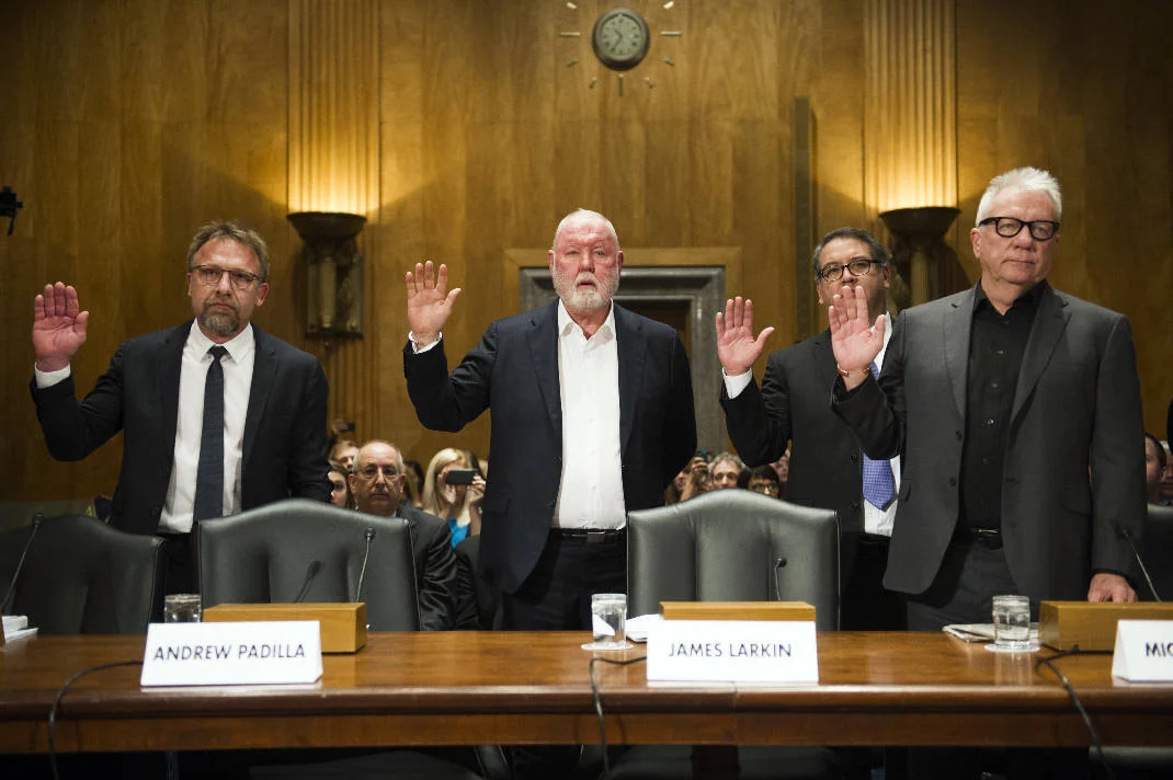 In this Jan. 10, 2017 file photo from left, Backpage.com CEO Carl Ferrer, former owner James Larkin, COO Andrew Padilla, and former owner Michael Lacey, are sworn-in on Capitol Hill in Washington, prior to testifying before the Senate Homeland Security and Governmental Affairs subcommittee hearing into Backpage.com's alleged facilitation of online sex trafficking. Ferrer, Lacy and Larkin appeared in Sacramento Superior Court Tuesday, Jan. 24 to face renewed charges that include pimping, conspiracy and money laundering. (AP Photo/Cliff Owen, File). Photo by Cliff Owen