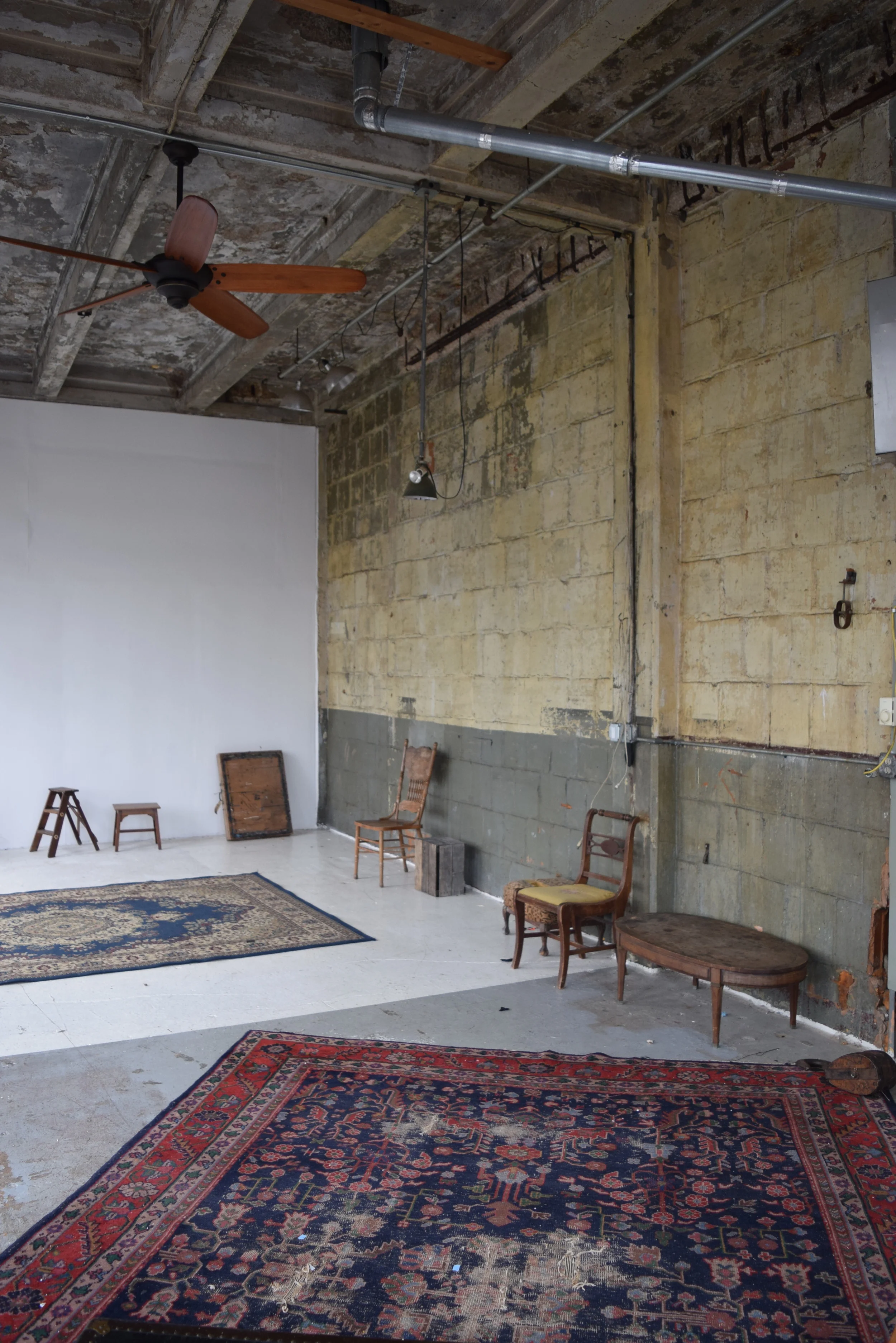 Rugs, tables, chairs, orchard crate, small ladder