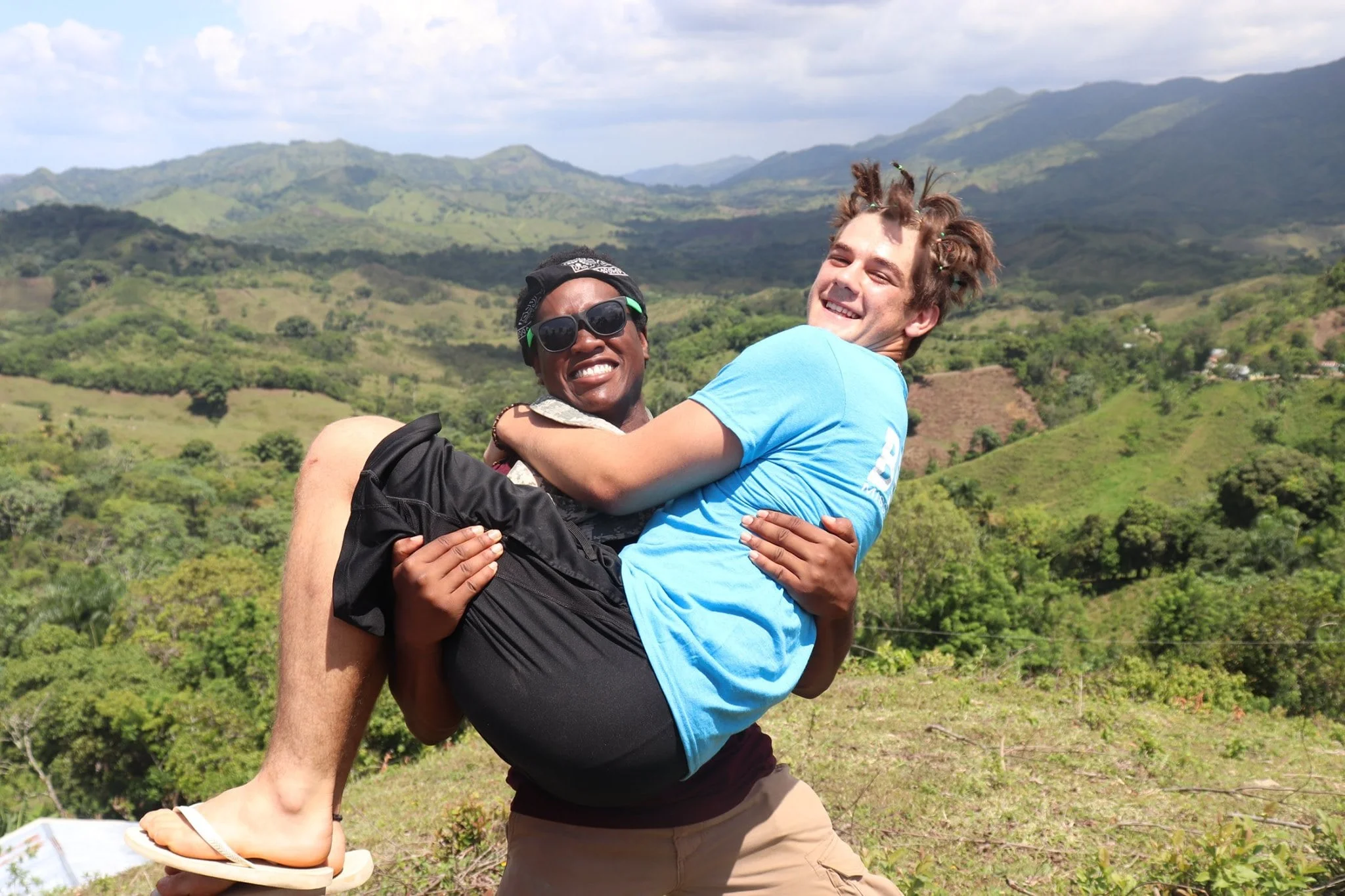 Teenager holding his friend and posing for a picture.jpg