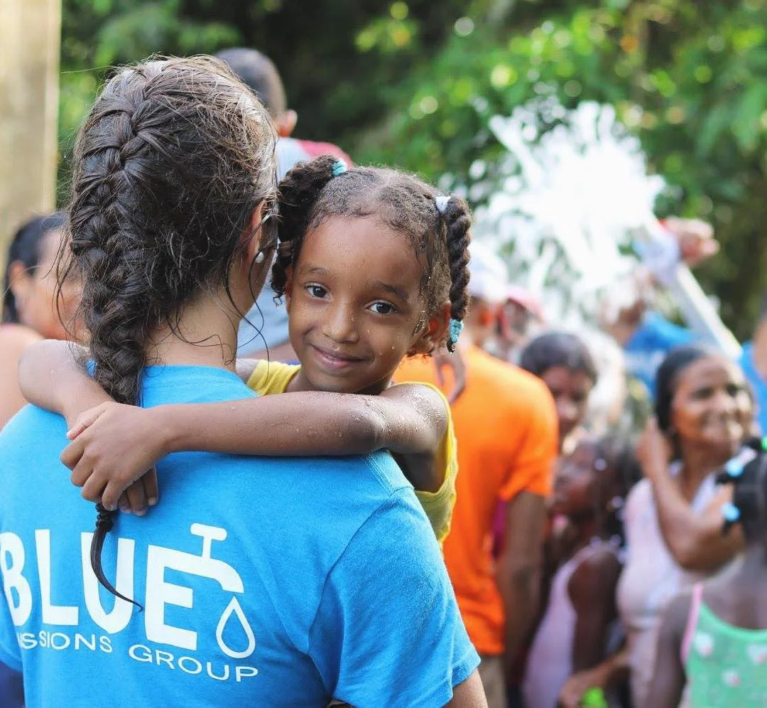 blue-missions-volunteers-with-a-local-community.jpg