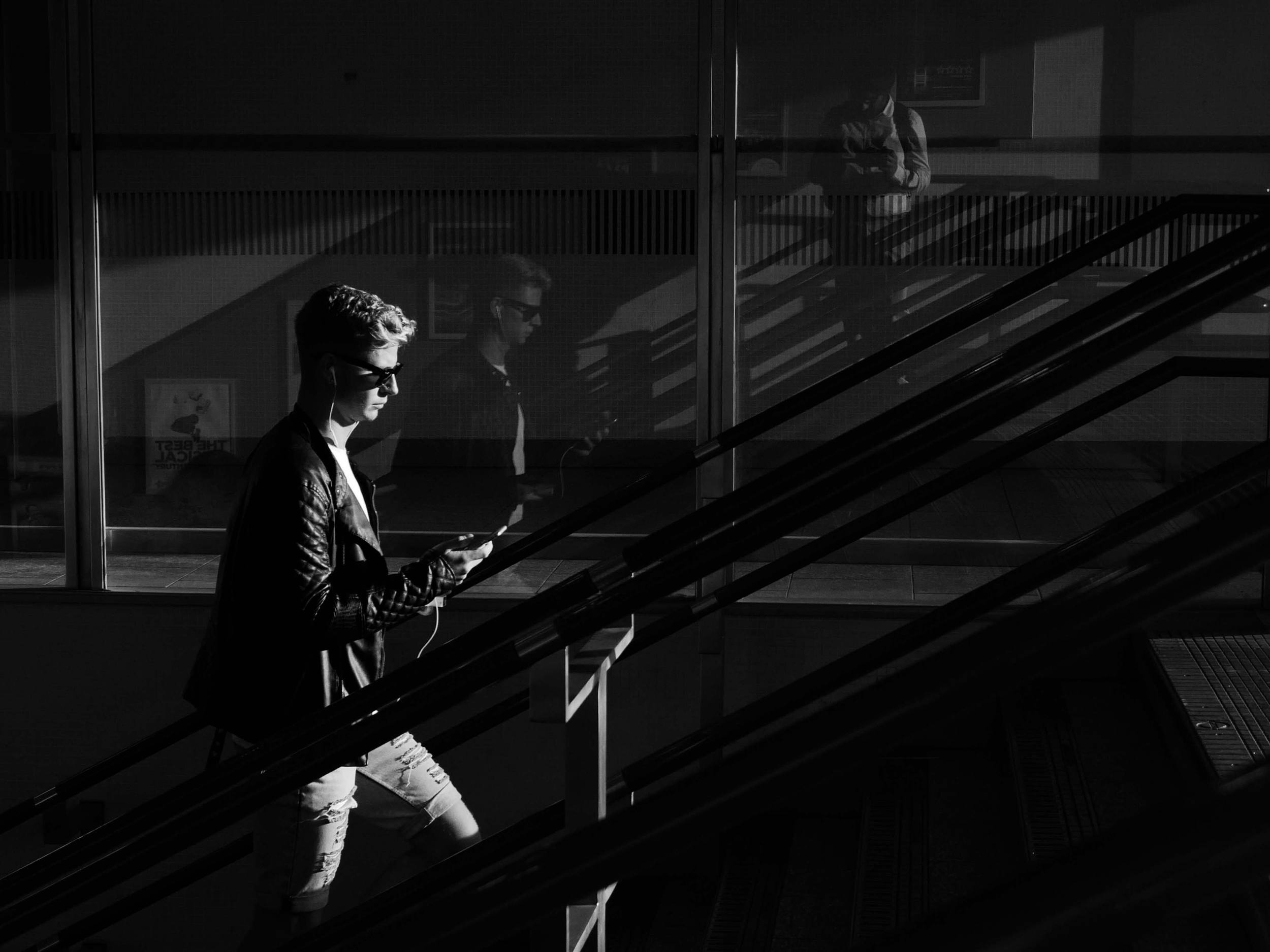 A 4Kphoto of a young boy and his relfection taken using LUMIX G7 camera at Kings' Cross station in London