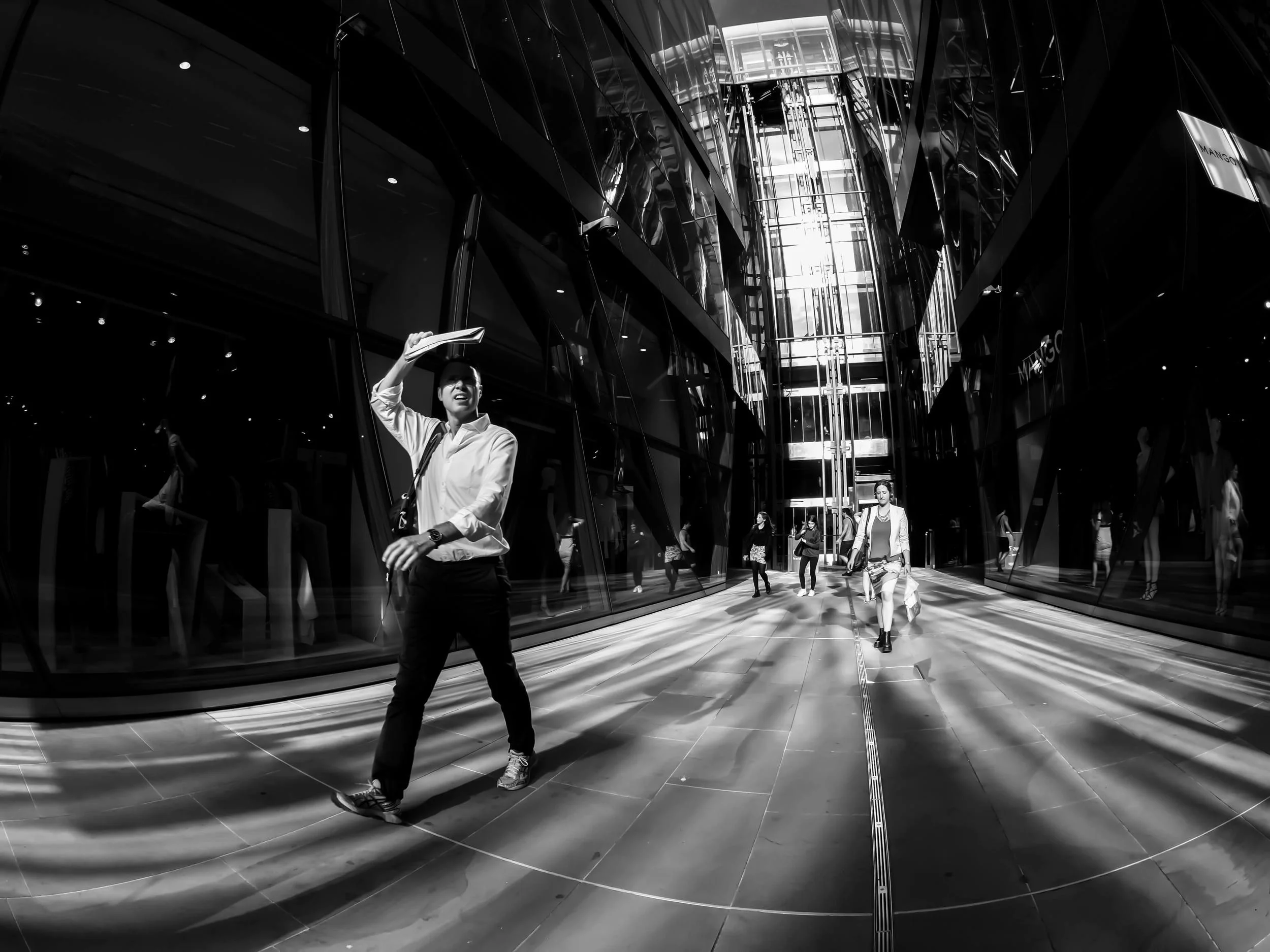 A photograph of people taken at One New Change shopping mall using a Fisheye lens in London