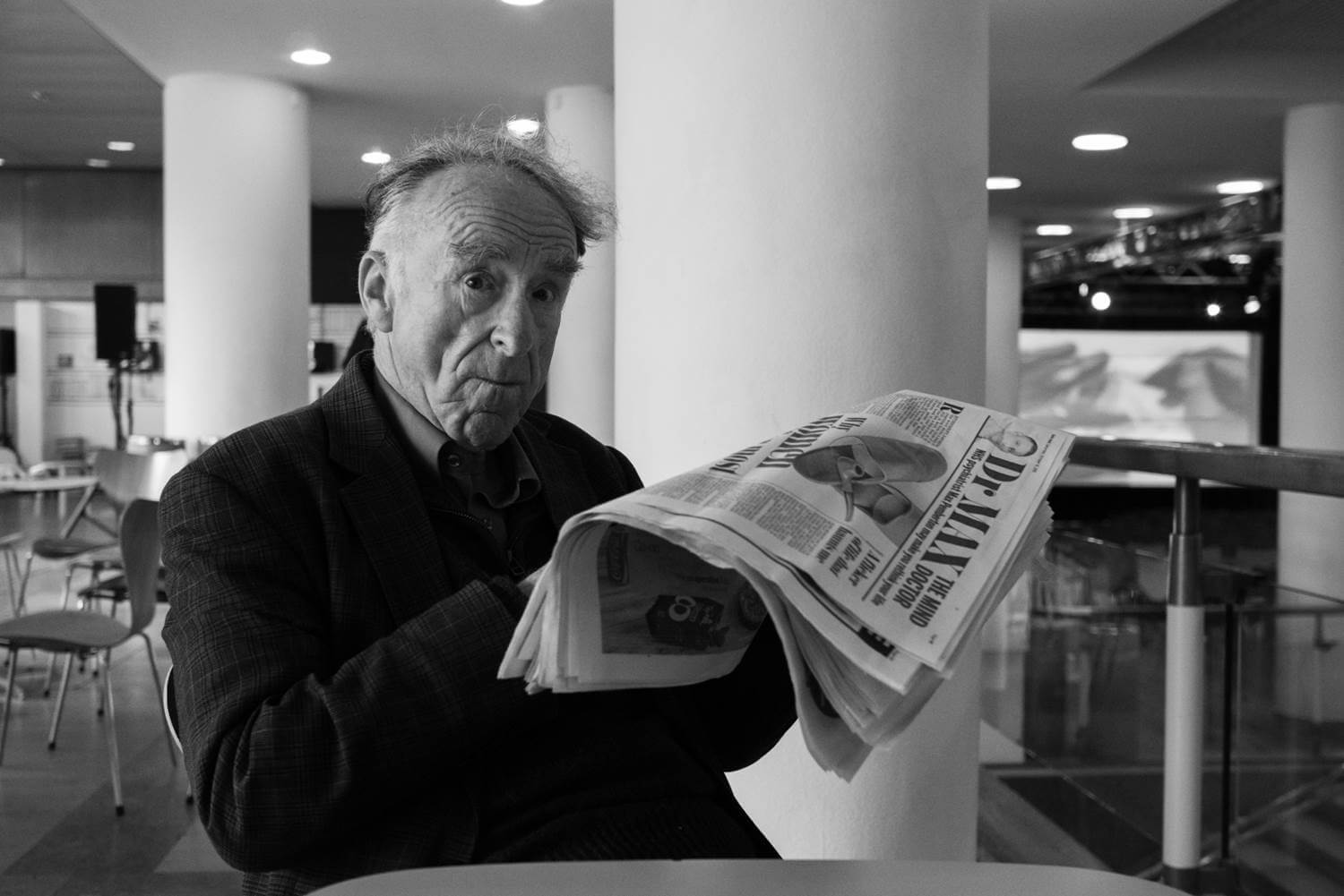 A photograph of an old man taken in Tate Modern in London during a street photography workshop