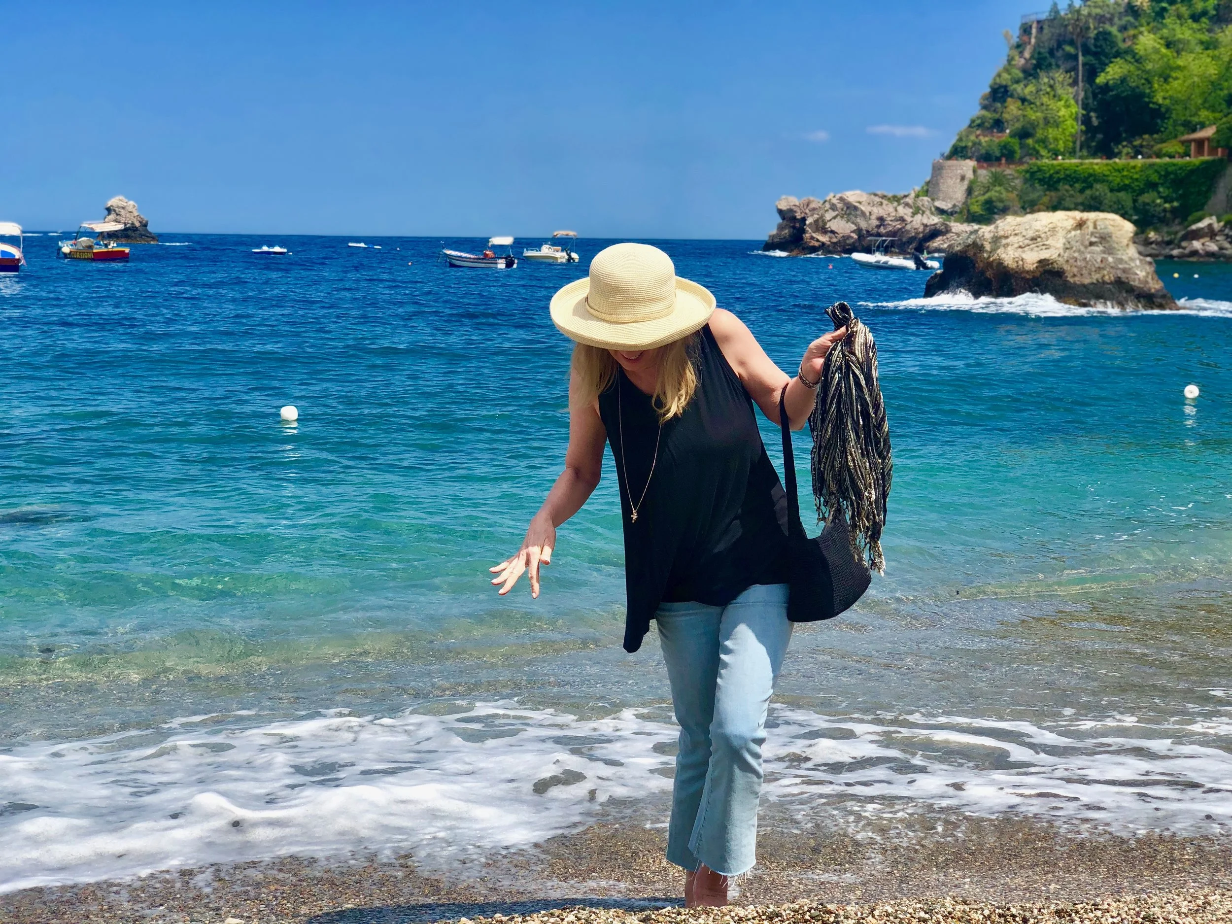 My pair of Paige cropped flare high waist jeans are comfortable, trendy AND appropriate for any age. Here, seen getting the hems wet in the Mediterranean Sea in Taormina, Sicily, Italy this May. The little bit of stretch makes for ingesting lots of wine, pasta, pizza and still travel comfortably.