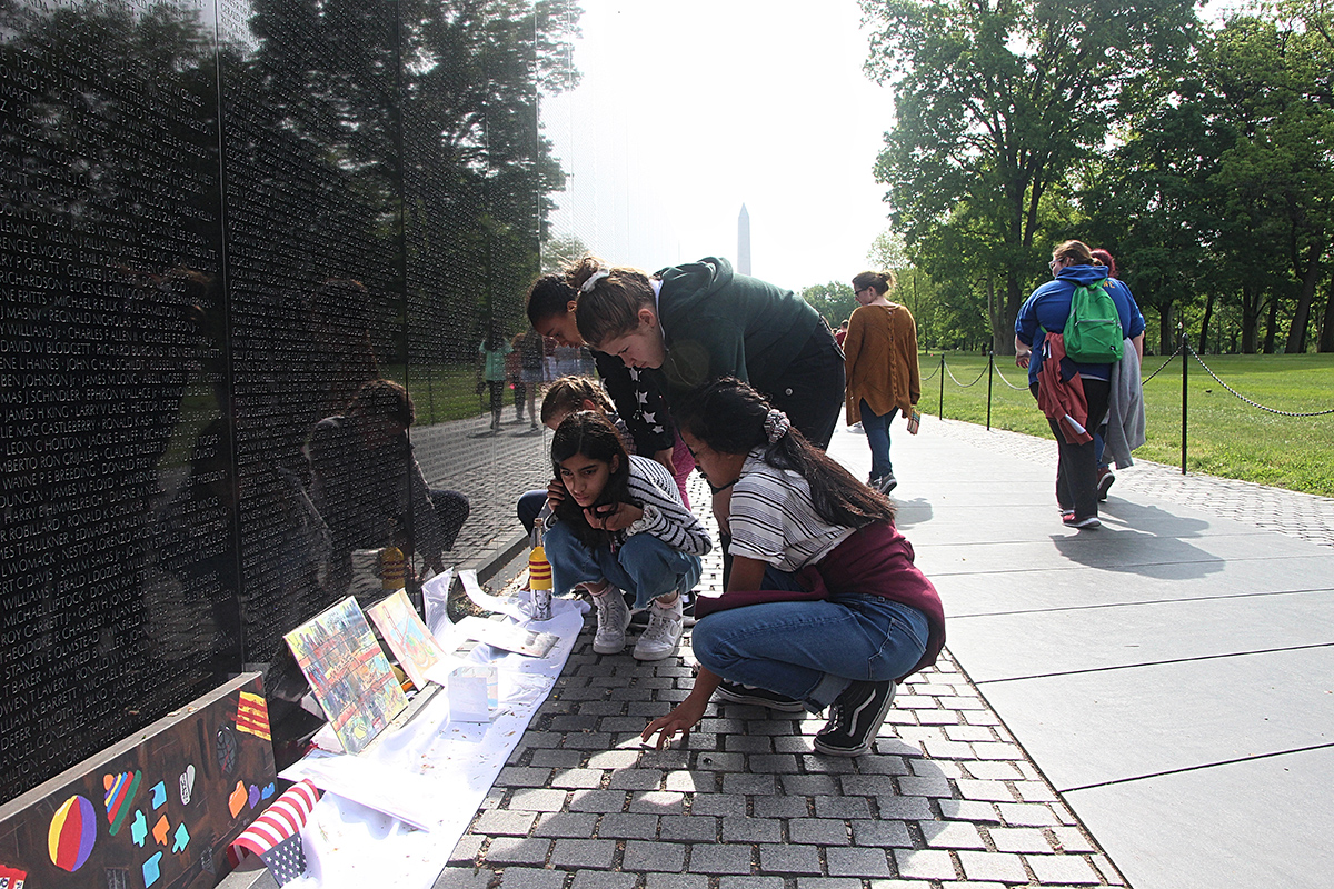 A Collective Intervention: Creating Space for Memory Work at the Wall for Refugees "All wars are fought twice, the first time on the battlefield, the second time in memory." -Viet Thanh Nguyen One of the most visible and public ways that the US has remembered its involvement in the Vietnam War is through the somber, black, wall erected on the Washington Mall in our nation's capital. The names of US veterans who died during the conflict are engraved into the Wall, while reflecting back the faces of visitors in its polished black marble. The Wall has been hailed as a profound site of healing for those that visit, often leaving items there dedicated to fallen loved ones or to let go of traumatic experiences. There are no Vietnamese names on the Wall. Framed in the nationalist context of the Washington Mall, this memorial conveniently "forgets" the Vietnamese (both civilians and veterans alike) and "remembers" American veterans as the primary victims of war. Yen Le Espiritu writes that "without creating an opening for a Vietnamese perspective of the war, these dramatic and public commemorations of the Vietnam War refuse to remember Vietnam as a historical site, Vietnamese people as genuine subjects, and the Vietnam War as having any kind of integrity of its own." This project calls for a collective intervention at the Wall by Vietnamese, Cambodians, Laotians, and other refugee community members still affected today by the legacy of American militarism and imperialism in Southeast Asia, allowing the community to reclaim their past experiences, history, and memories, on our own terms. This project envisions a nationwide, coordinated, mass dedication of items at the Wall by refugee community members on the upcoming April 30 anniversary in 2020 (45 years after US military withdrawal from Vietnam). However, this proposal asks for seed money for smaller-scale dedications organized by members of the progressive Vietnamese American organization VietUnity, to take place on April 30, 2019 (The first one took place on April 30, 2018). Items would be created, found, collected, by VietUnity members and their local networks throughout the year, then placed at the Wall on April 30, 2019 by several VietUnity representatives. Since its opening in 1982, national park rangers have collected all items left at the Wall, which are catalogued and stored in a national archive. During a visit to the archive in 2015, with the help of archive staff, I found that only six items had been left by members of the refugee community, out of thousands. There has been both an explicit (the names of your dead are not here) and implicit (this space is not for you, don't leave your items here) exclusion of refugee voices from this national memorial. The coordinated, mass dedication of items from the refugee community at the Wall on April 30, 2020 would act as a physical and symbolic disruption of the US nation state's memory project that justifies US militarism and imperialism in Southeast Asia and other parts of the world through the "forgetting" of its victims, both in the past and present. This intervention centers refugee experiences in ways that refugee community members will determine for themselves, as a collectively curated archive of objects and memories, rather than one designed by state institutions or policy-makers. The open nature of the collective archive insists that the refugee community is not a monolith; that there are complex disjunctures, contradictions, and intersections in our identities and in the ways that we remember the conflict and its continuing legacies felt in our everyday lives today. This project carves out space for a public, nationally recognized memorial formed from the collective engagement of diverse voices in the refugee community rather than one determined by the policies of any single institution. -Kim Tran Thank you VietUnity members for allowing me to collaborate with ya’ll on this project.