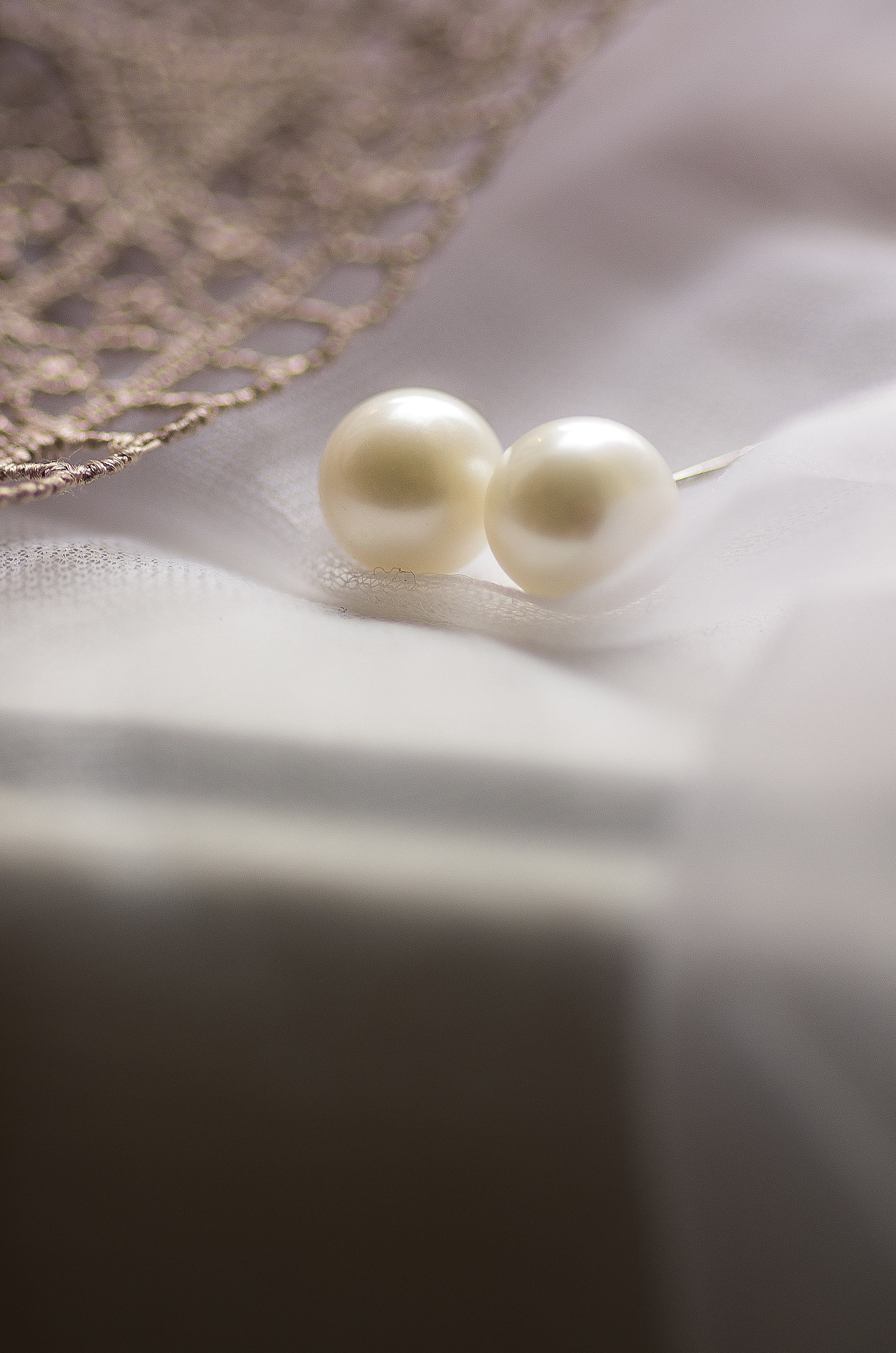 Pearl Earrings in soft light captured by Let There Be Light Photography