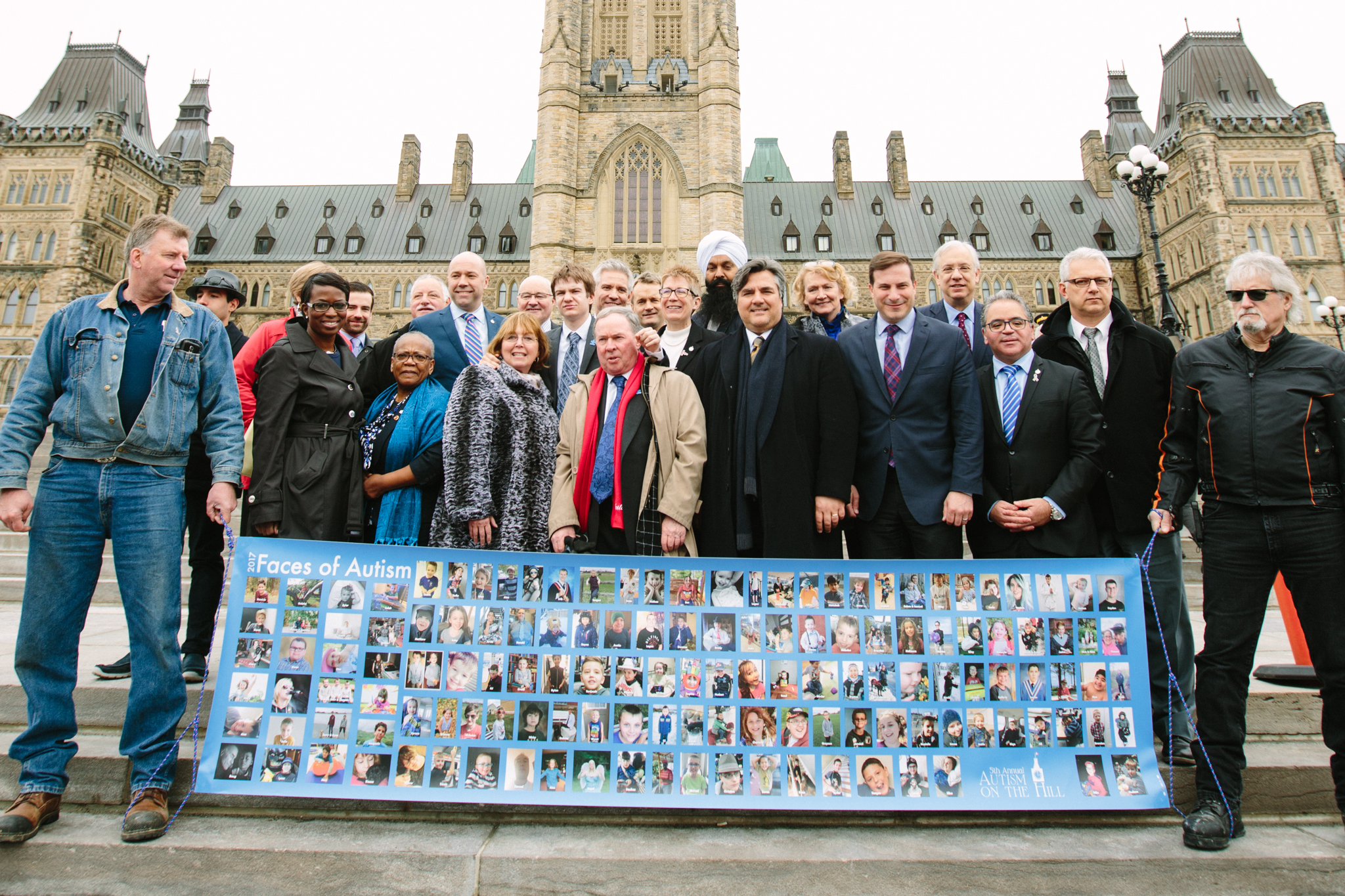 MPs and Senators with banner.jpeg