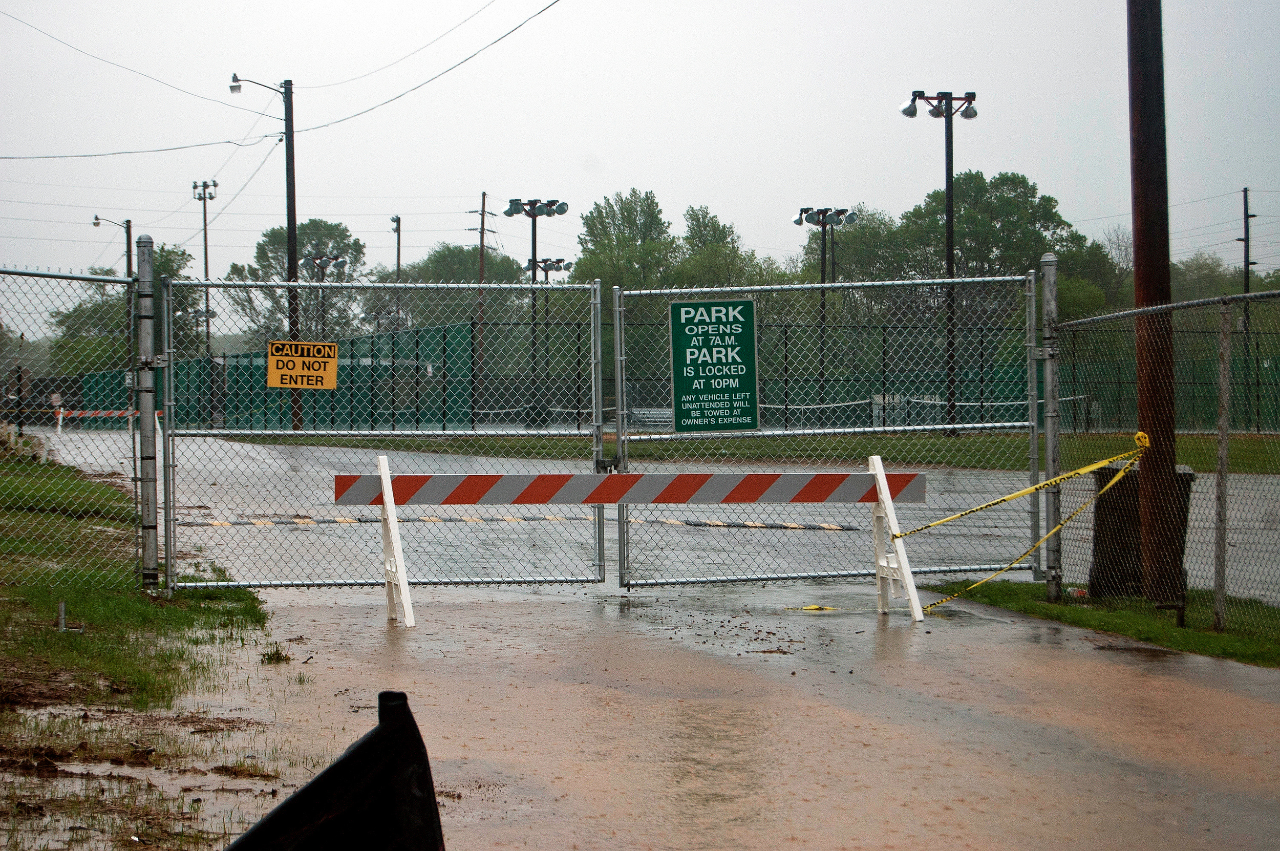 Gates locked at Gorin Park to protect public from flooding dangers.