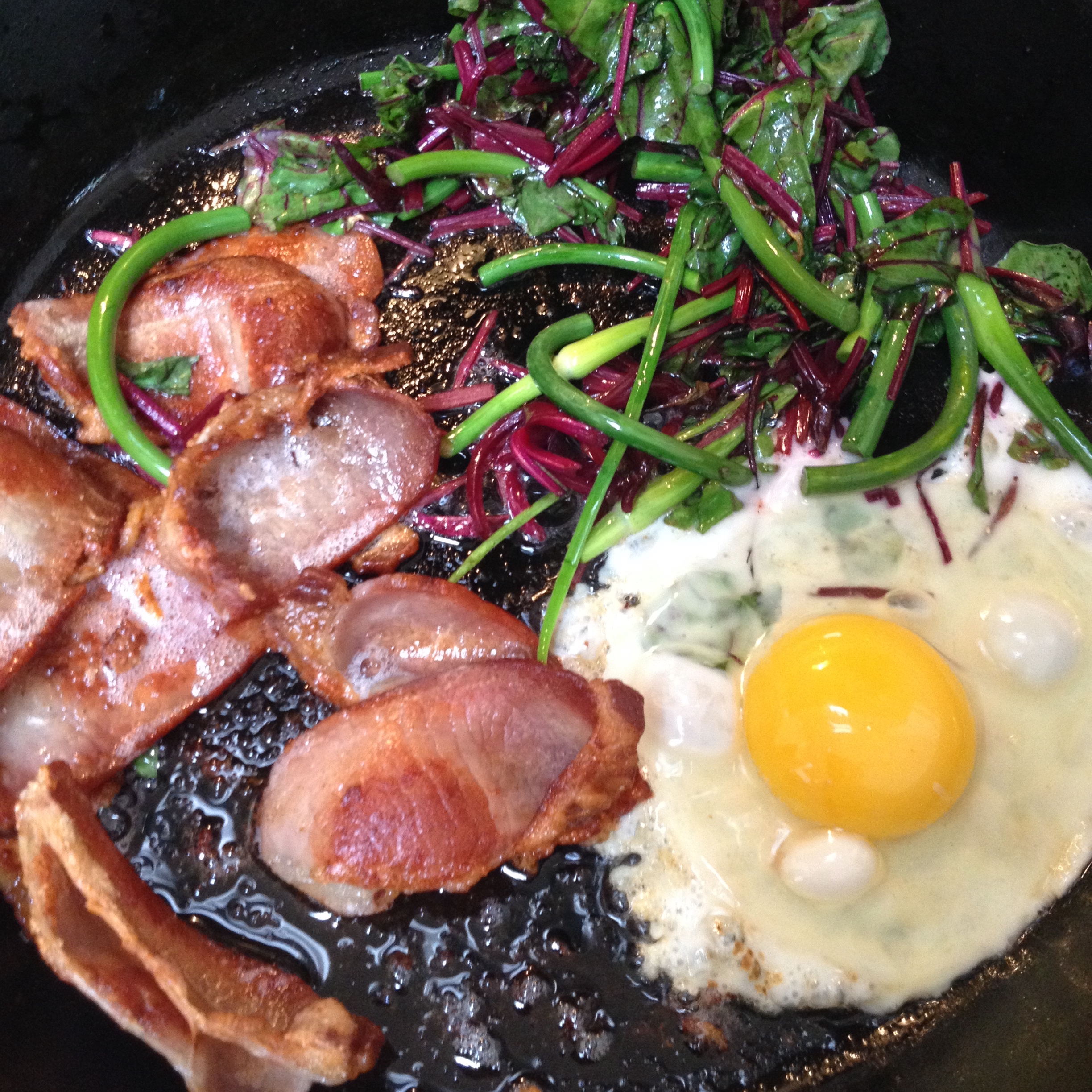 I treated myself with bacon, eggs, beet greens, and garlic scapes