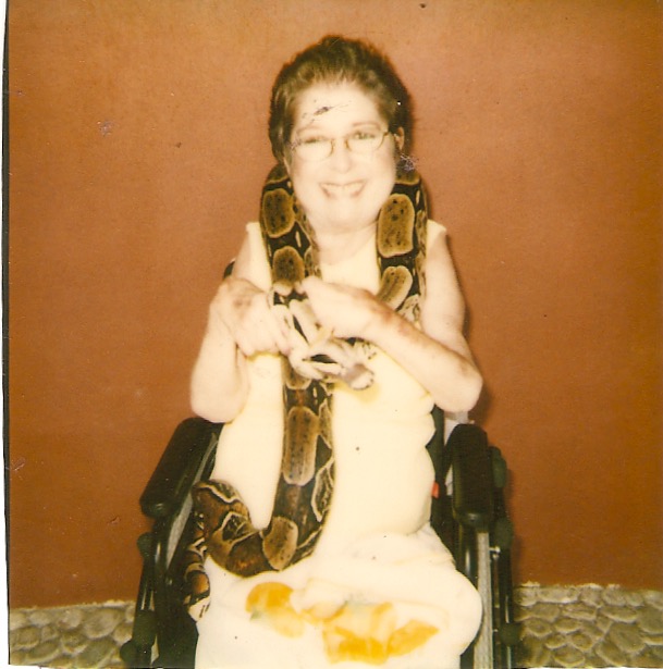 And yes, that's my mom, in her wheelchair.. holding a live boa.
