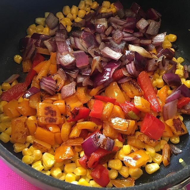 This BLACK BEAN CORN SALSA is one of those recipes that hardly requires measuring utensils or instructions. 
Saut&eacute;ed red onion in a drop of EVOO until transparent. Added chopped red &amp; orange peppers, and then corn (flash frozen organic.) T