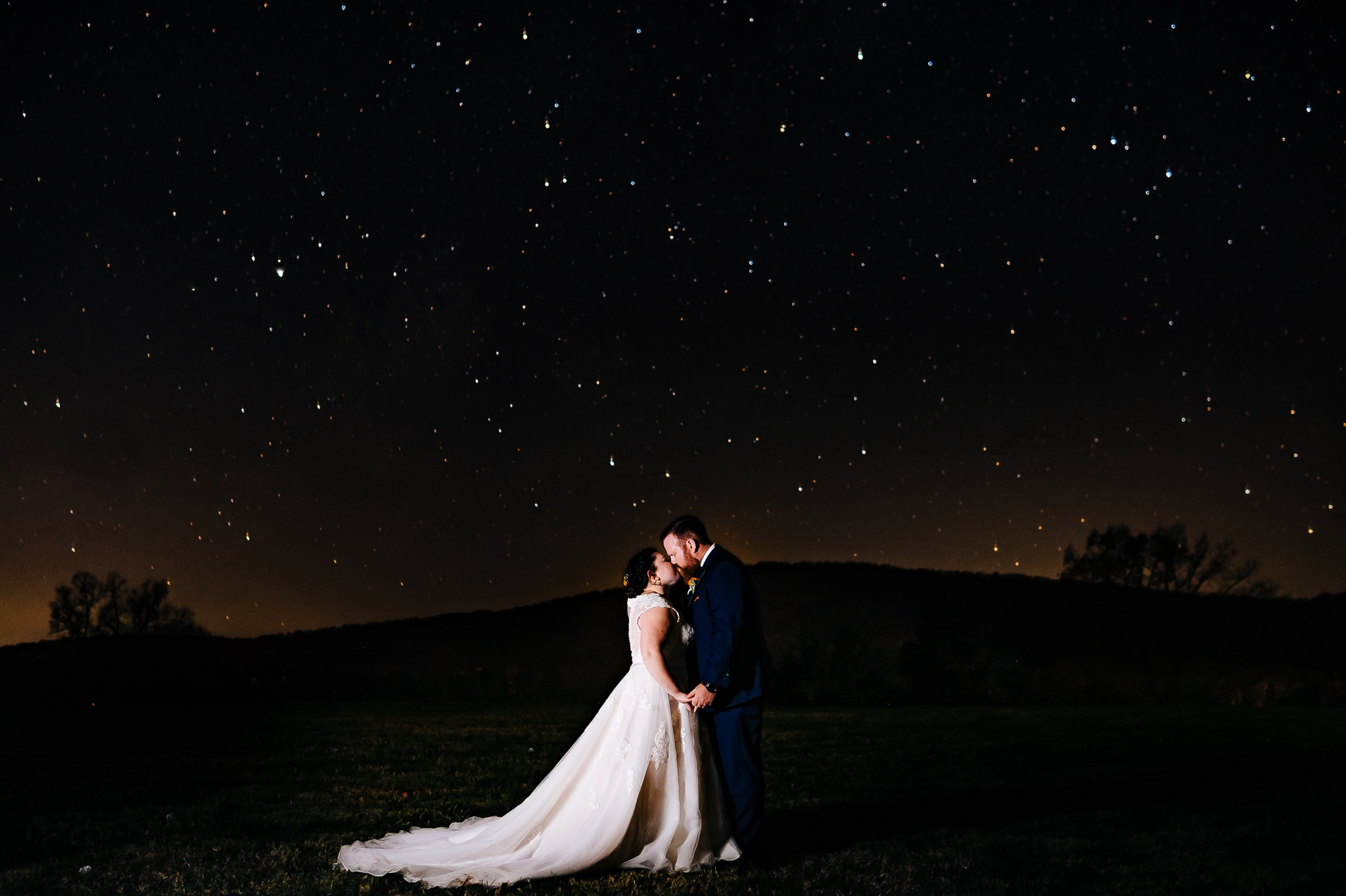 Bride_and_groom_night_portrait_standing_in_field_at_wolftrap_farms_by_jonathan_and_hannah_photography
