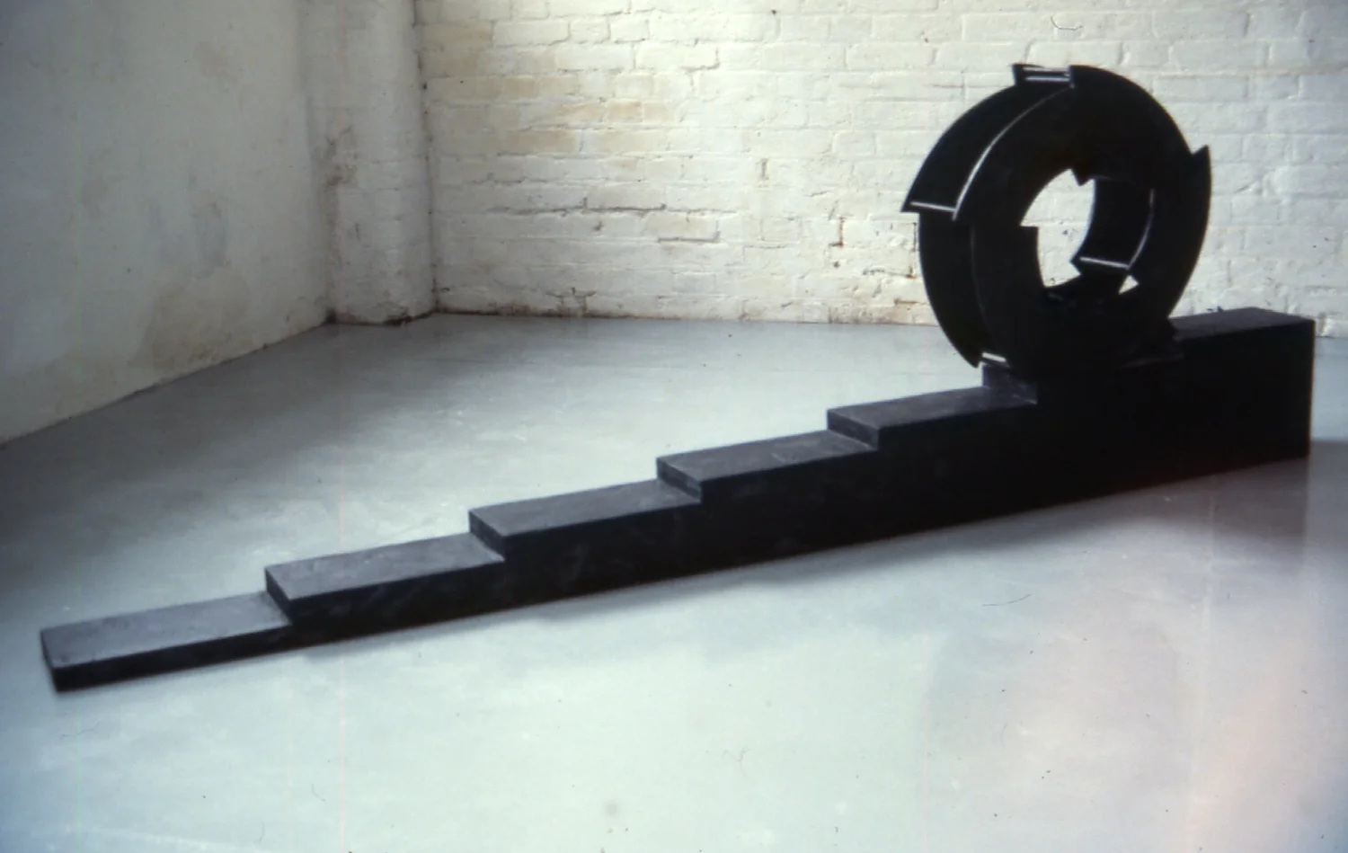 Wheel descending a staircase 1994 mixed media
