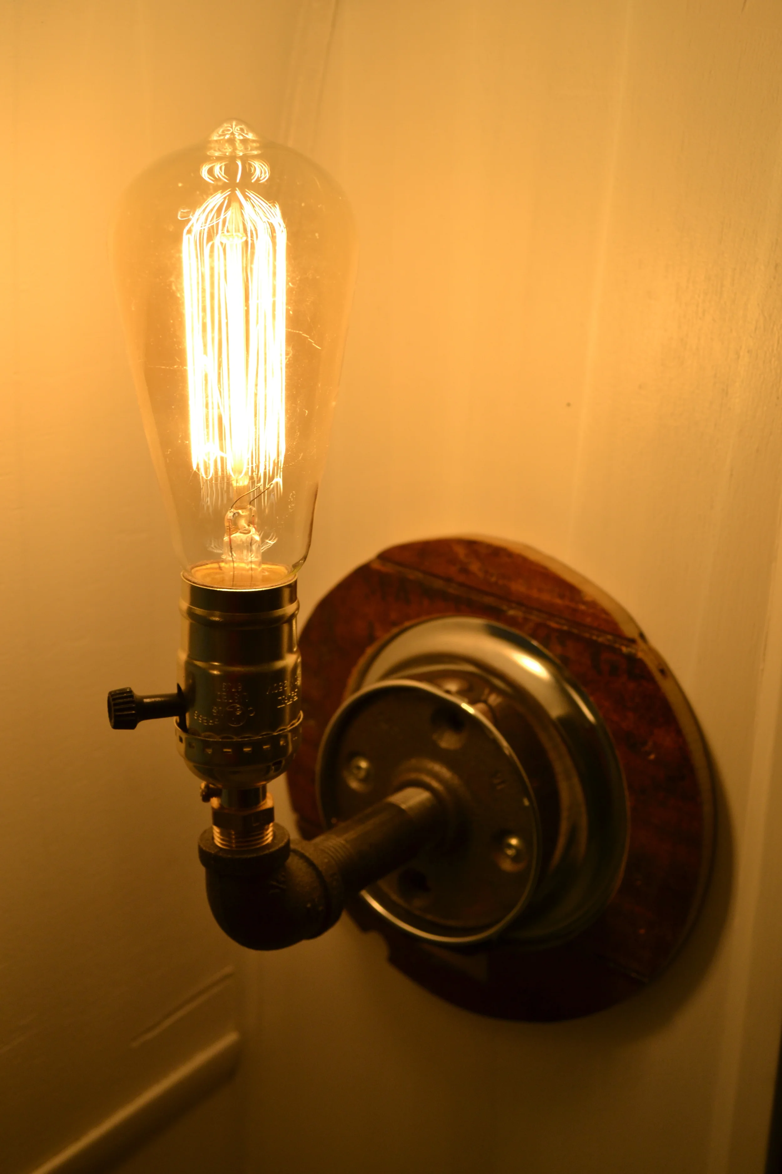 Edison bulb in our finished pipe light.