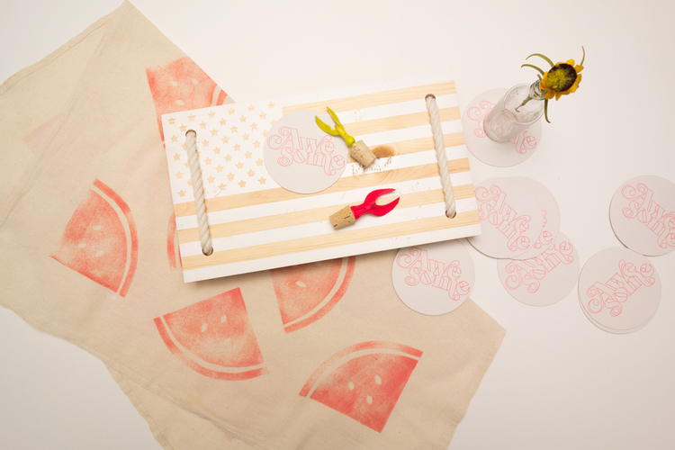Tabled's Picnic in the U.S.A. collection. Includes one extra large watermelon print table square, a set of 10 Awesome coasters, a yellow or hot pink eagle bottle stopper (made from an old trophy!), and a handmade U.S.A. flag serving board.&nbsp;