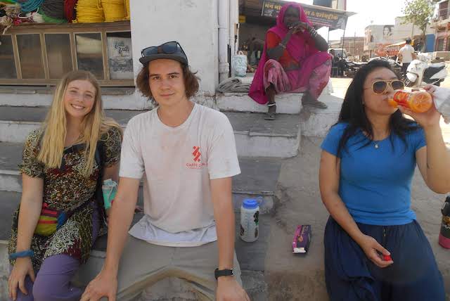 Charlotte, Owen, and Kari taking a much needed rest at the market.