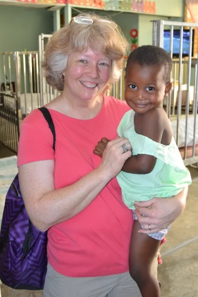 The team really enjoyed playing with the children at Grace Children's Hospital and being able to show them love and care by holding them. Here, Mariann holds one of the children in the inpatient ward, and below Daniel holds another.
