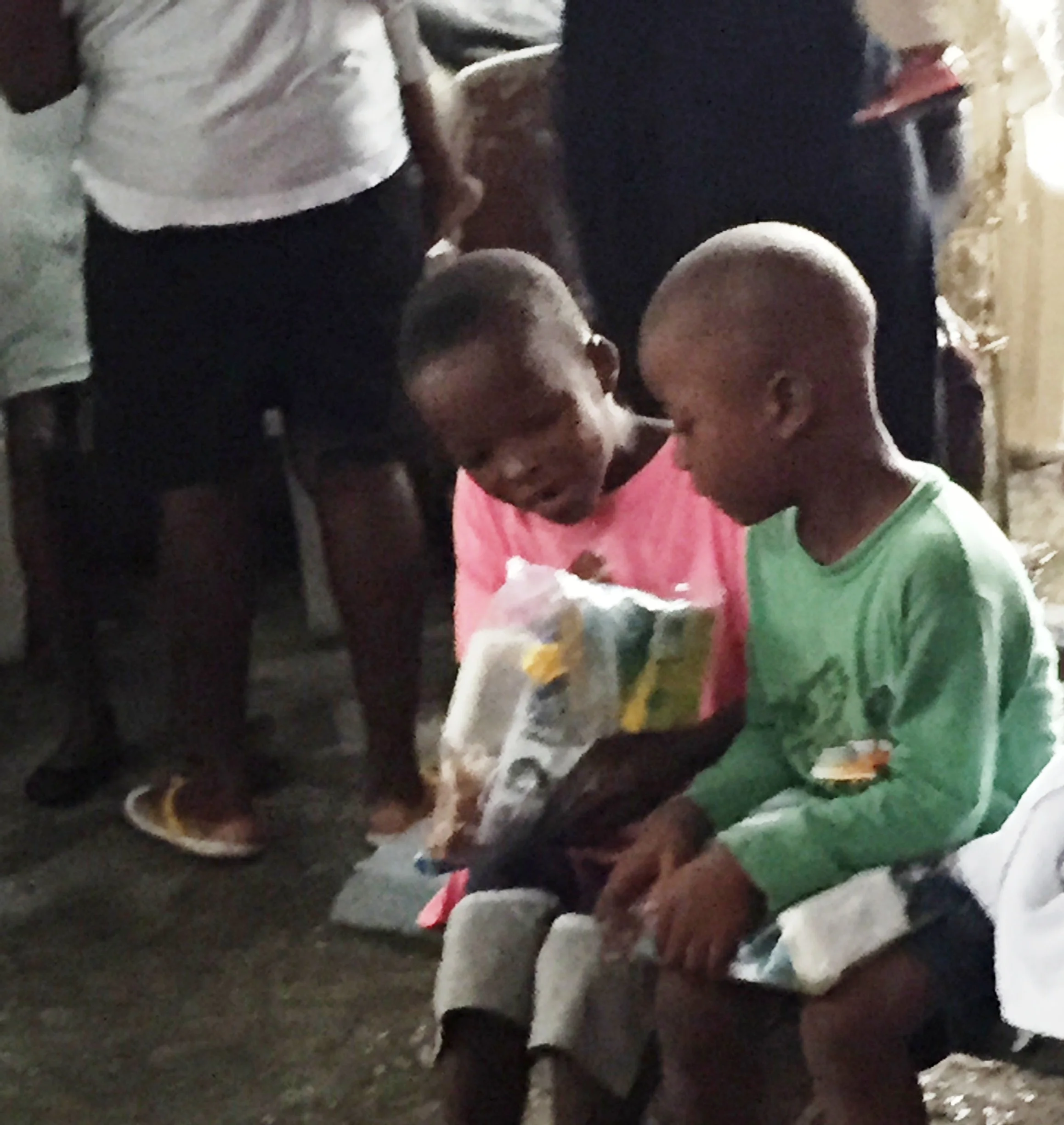 Two excited boys explore their care kit.
