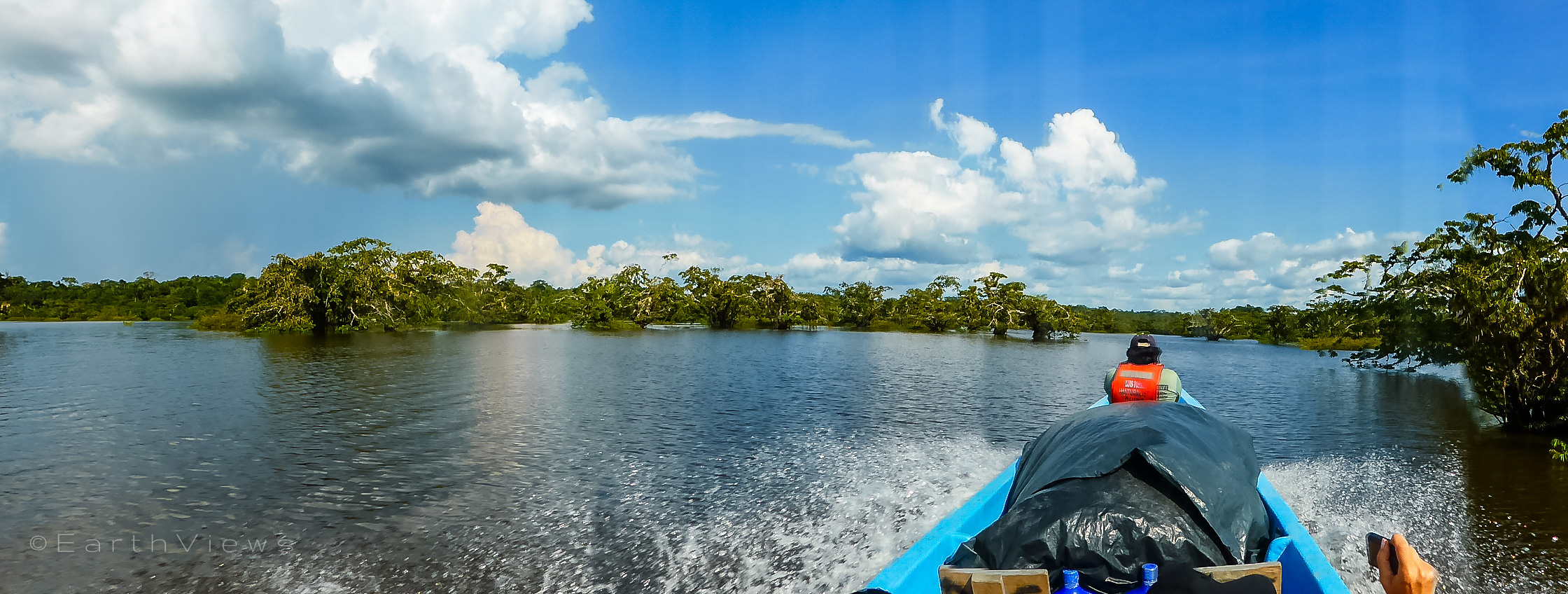 Our naturalist guide, Luis Torres, spotting wildlife in the boat’s front.