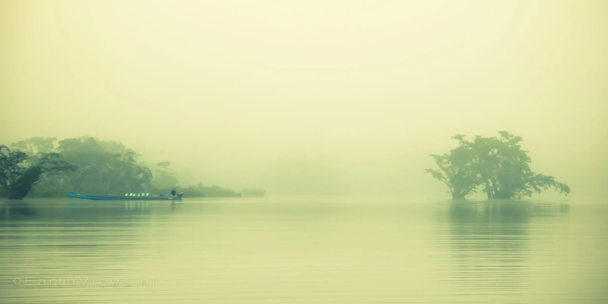 Another boat in the mist.
