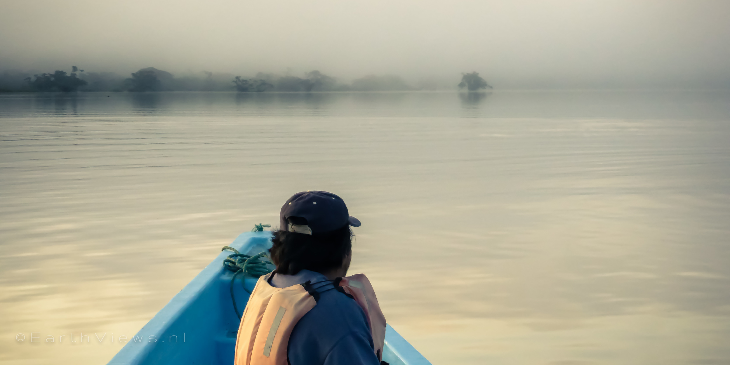 Luis searching for pink dolphins on our early morning boat trip.