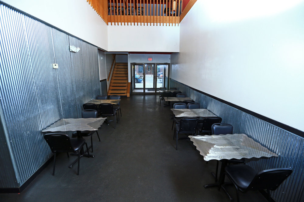 Lower level dining area facing building entrance.jpg