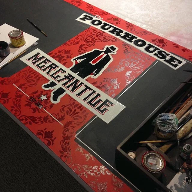 Hand-painted signage integrated with chalkboard windows allows staff to change items frequently while keeping prohibition-era branding on-point for @thepourhousempls.