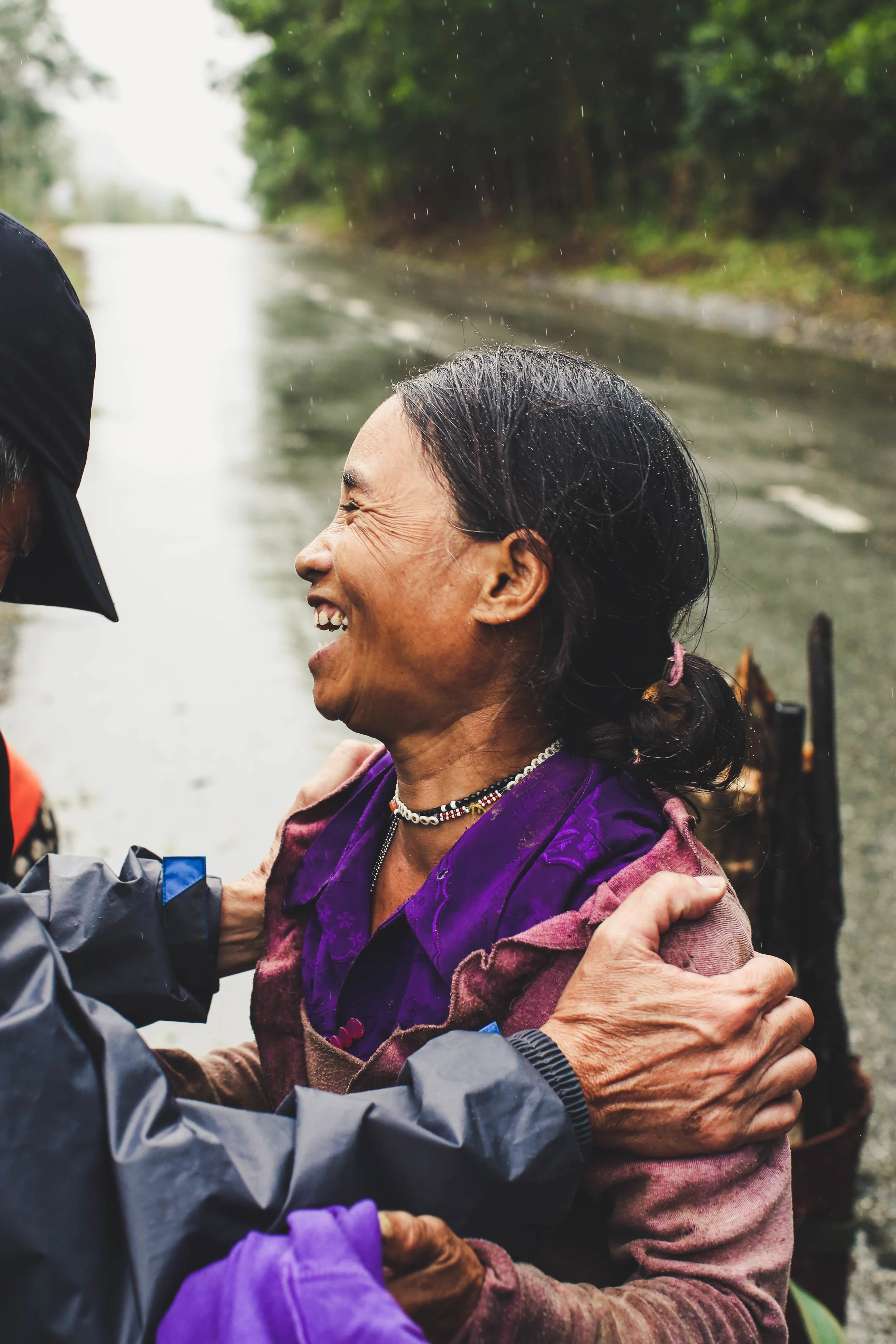 Lending a helping hand spreads smiles all around. Mountains of Da Nang, Vietnam