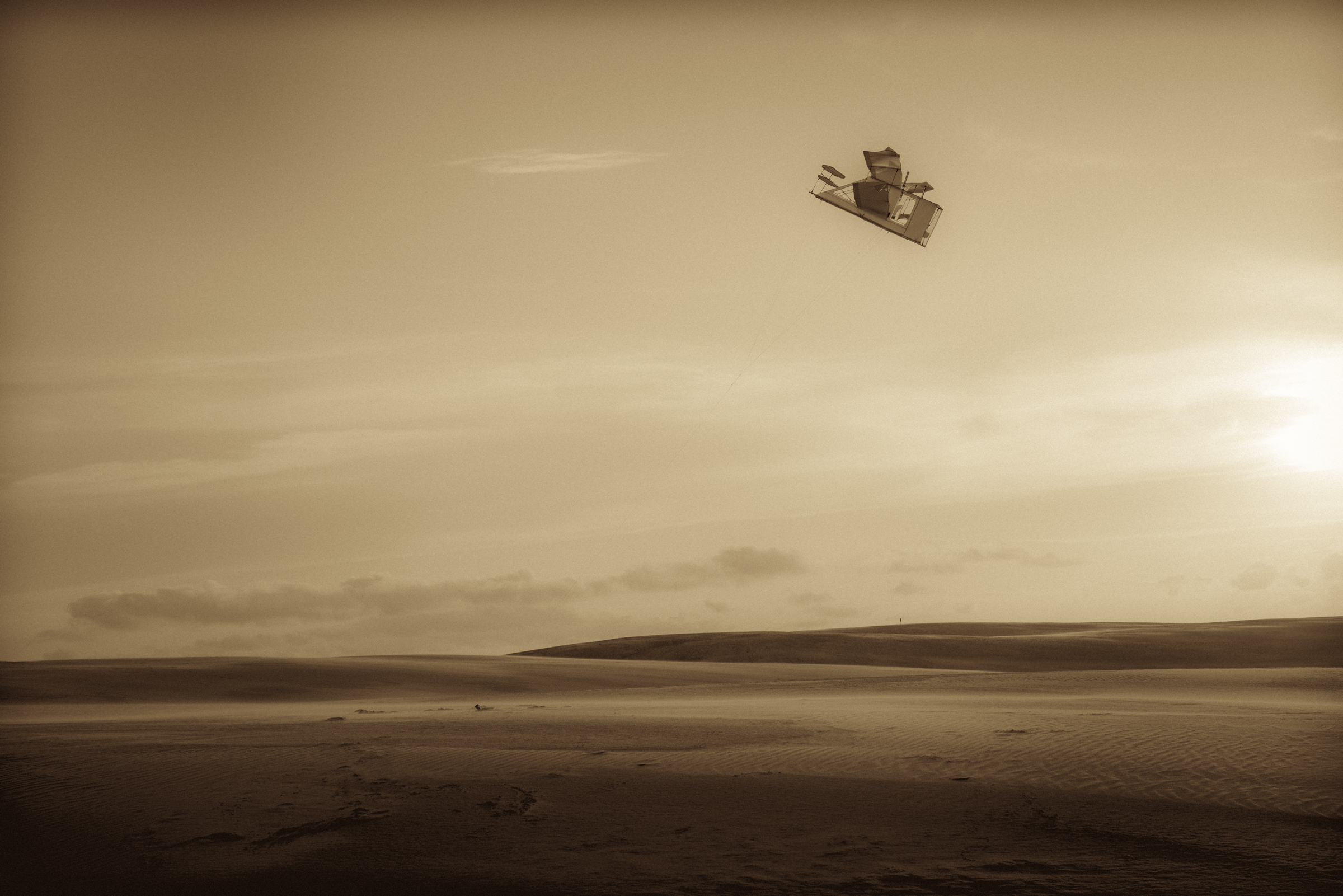 A kite inspired by the first powered flight by the Wright Brothers on the dunes of Jockey Ridge State Park, a few miles south of the spot where the Wright Brothers flew at Kitty Hawk, North Carolina.