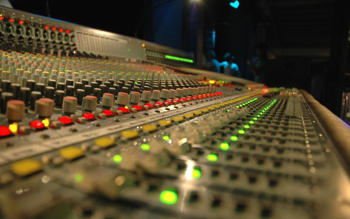 a picture of a mixing desk in a recording studio