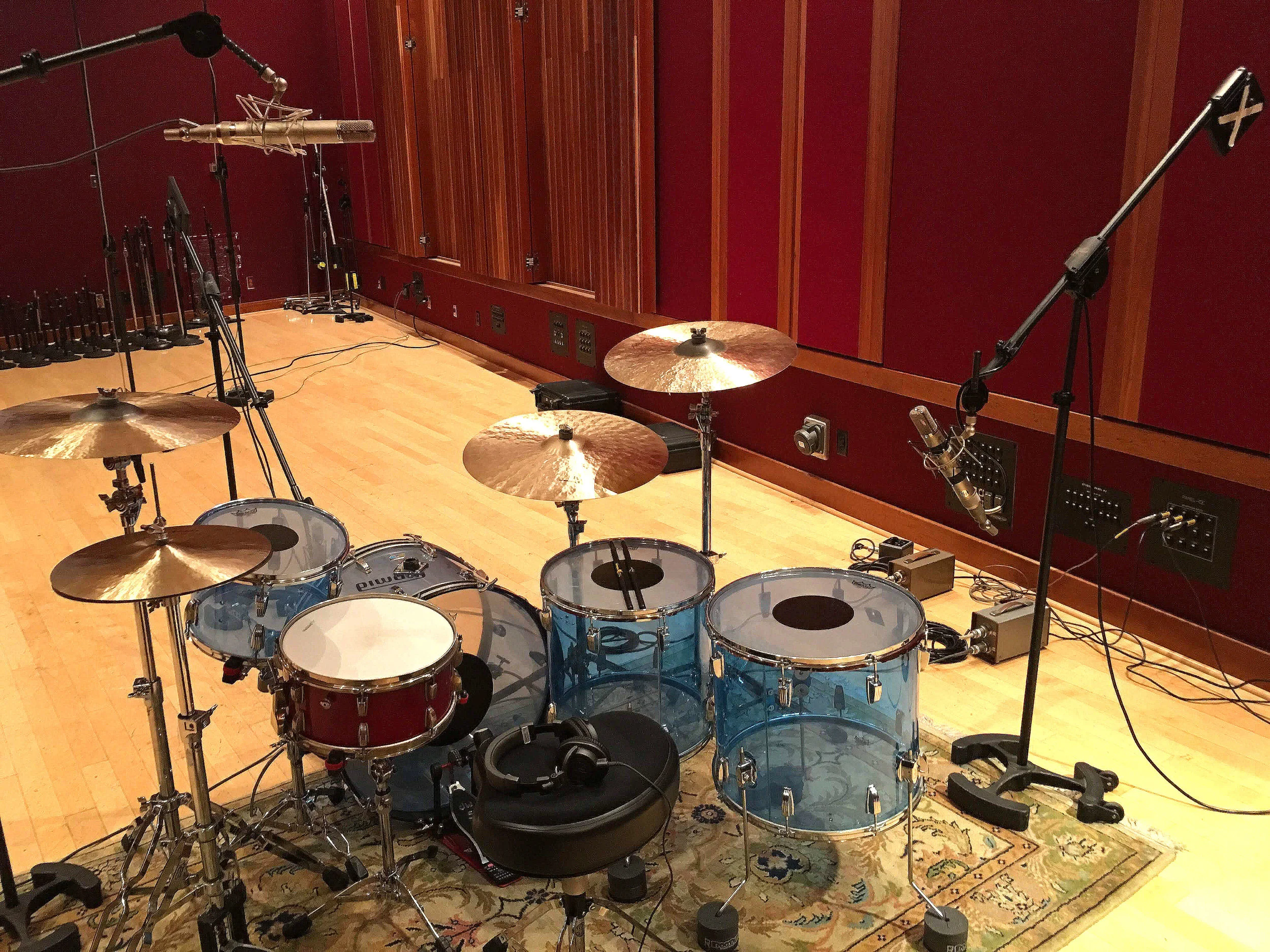 Close mics viewed from behind the kit